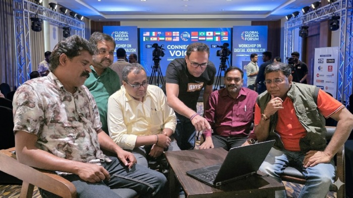 Global media professionals collaborating at international conference